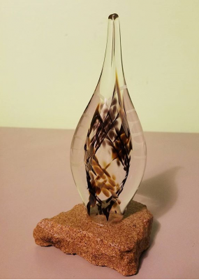 A simple hand-formed memorial glass piece.
